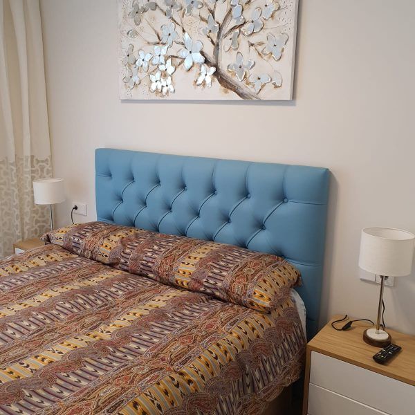 ambiente cabezal tapizado moderno capitone loyra dormitorio matrimonio